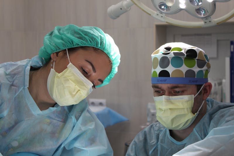 Healthcare professional reviewing patient treatment records