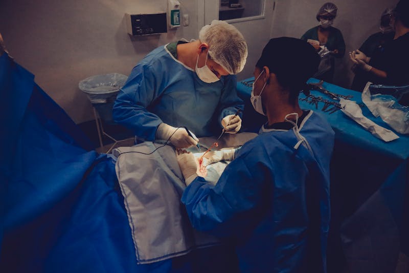 Surgical team performing operation requiring anesthesia monitoring and billing