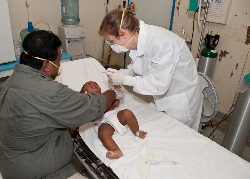 Healthcare worker in protective equipment providing community health care during pandemic