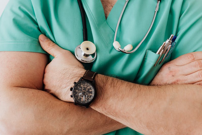 Healthcare professional in scrubs ready for clinical documentation