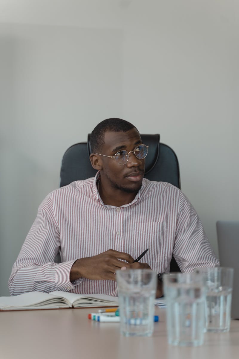 Professional seated at an office meeting table