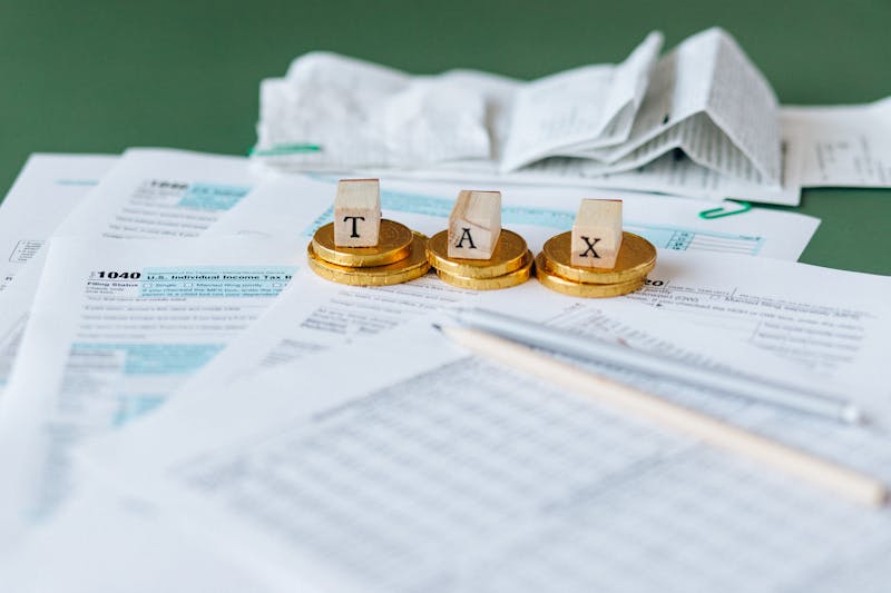 Tax planning documents with 1040 forms and financial calculations